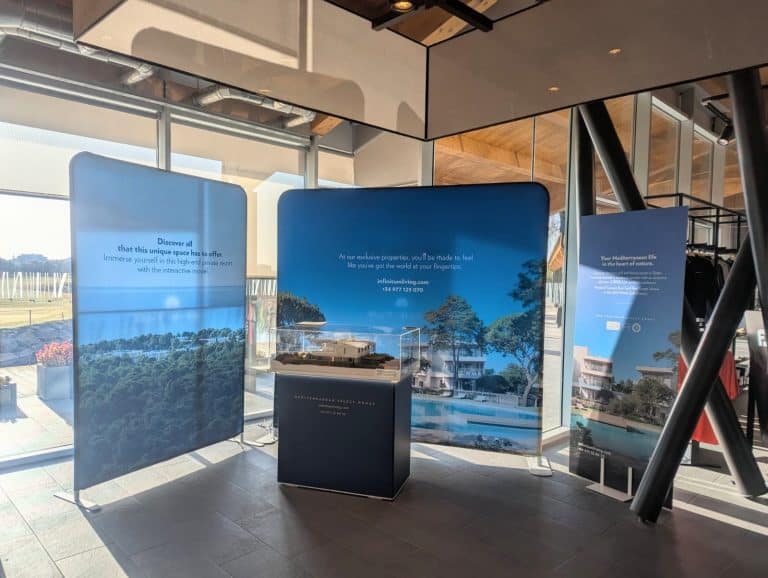 Modern exhibition display panels showcasing architectural projects at Grup Bou headquarters