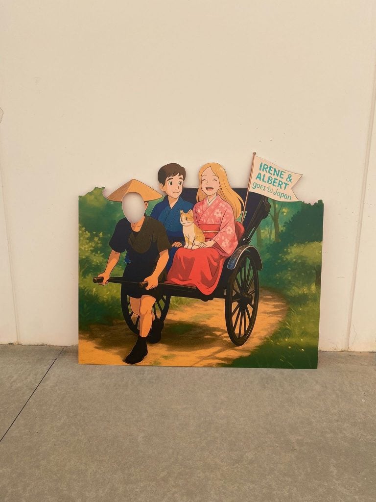 Family portrait with a woman, a man, and a child in a wheelchair outdoors